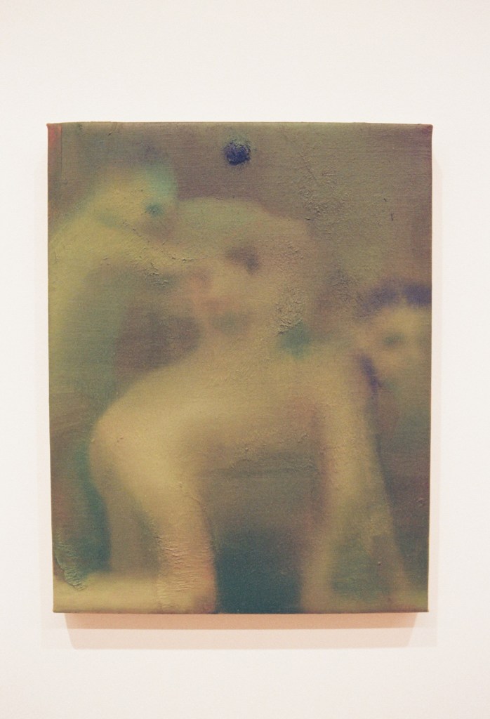 A close-up image of a painting by Elizabeth Glaessner. It is hazy, with browns, greens, and beiges. There is a vague figure of a person on all fours and a disembodied face.